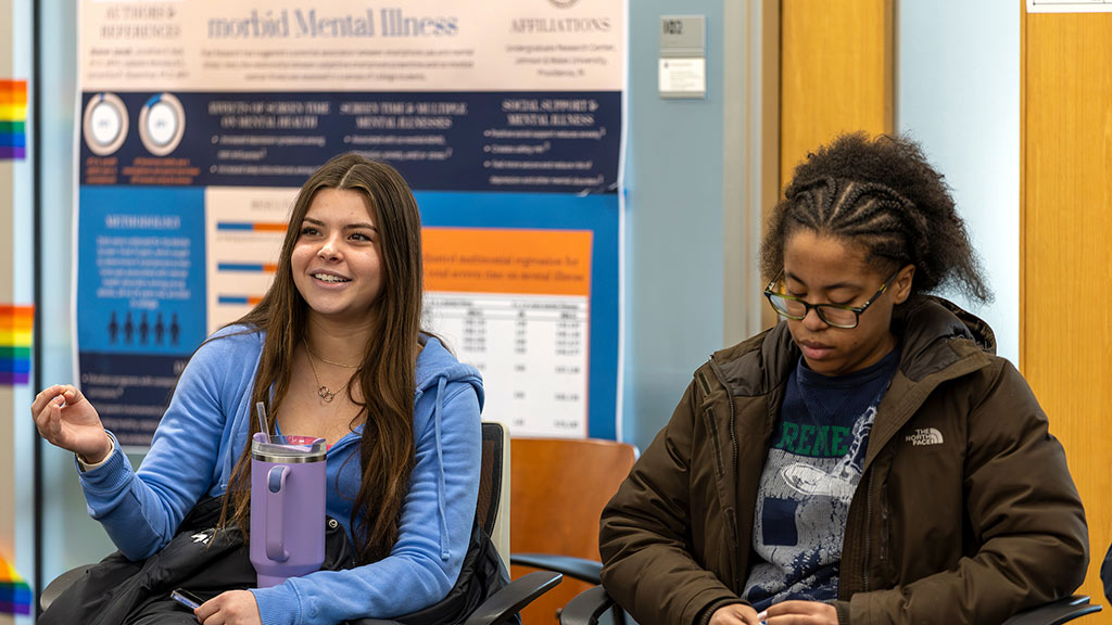 candid of a seated student speaking
