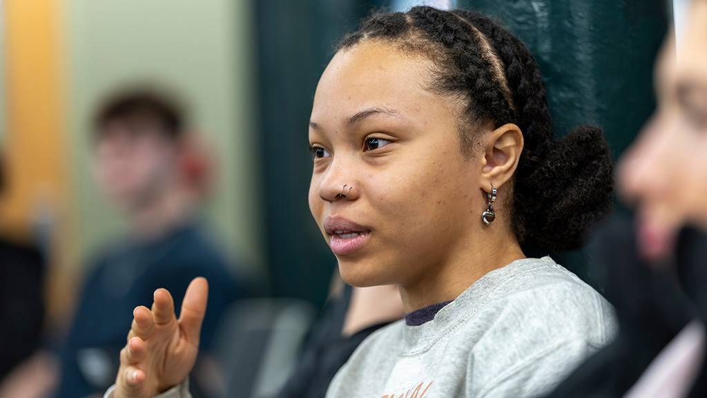 candid of Cora Hicks '27 speaking