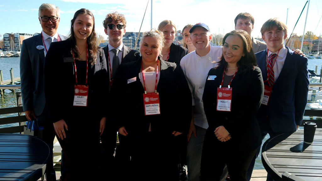 Photo caption: Students at the Annapolis Yacht Club with alums Brian Asch ’96, general manager (back, left) and Hannah Kerr ’23, chef (front, center).