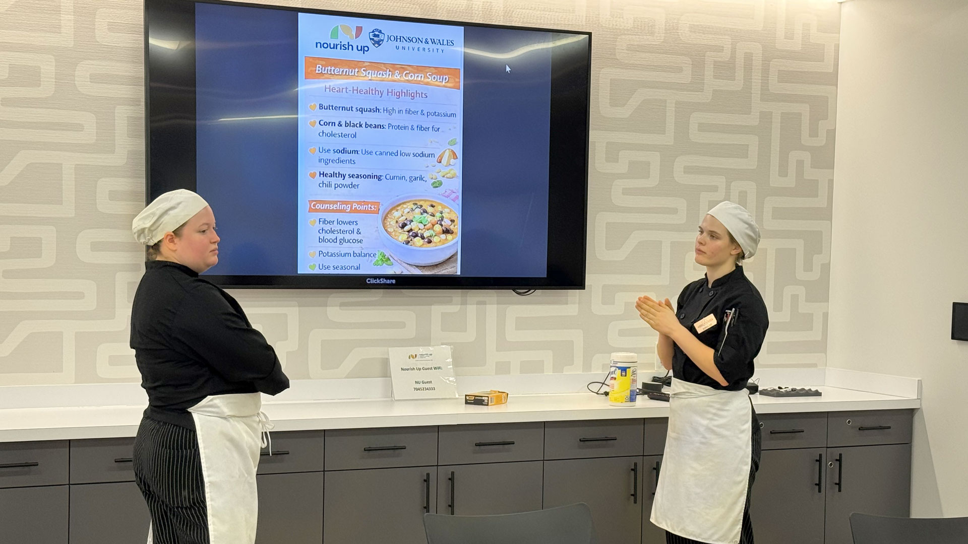 JWU students Peyton Parker & Amalee Barrett share nutrition advice at Nourish Up.