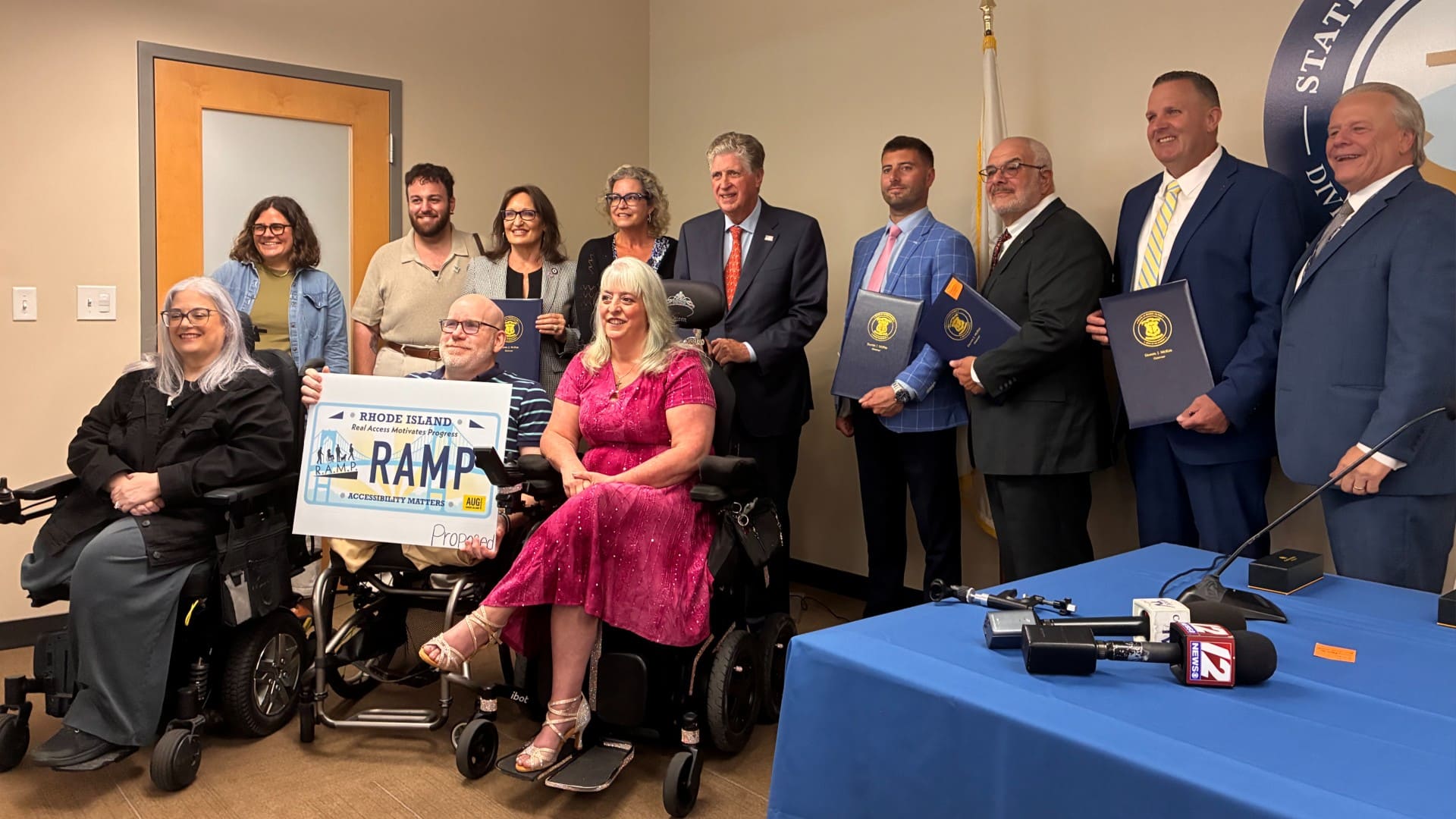 Gov. Dan McKee signed legislation authorizing two new disability access license plates in Rhode Island
