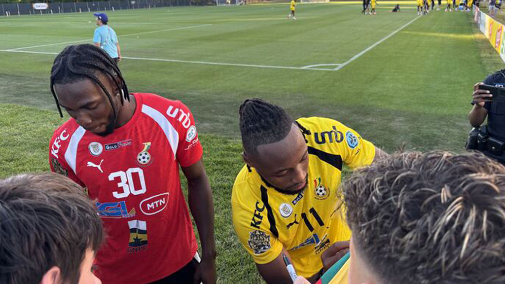 Ghana Men's team giving autographs at their Base Camp at Bryant University to a youth soccer team.