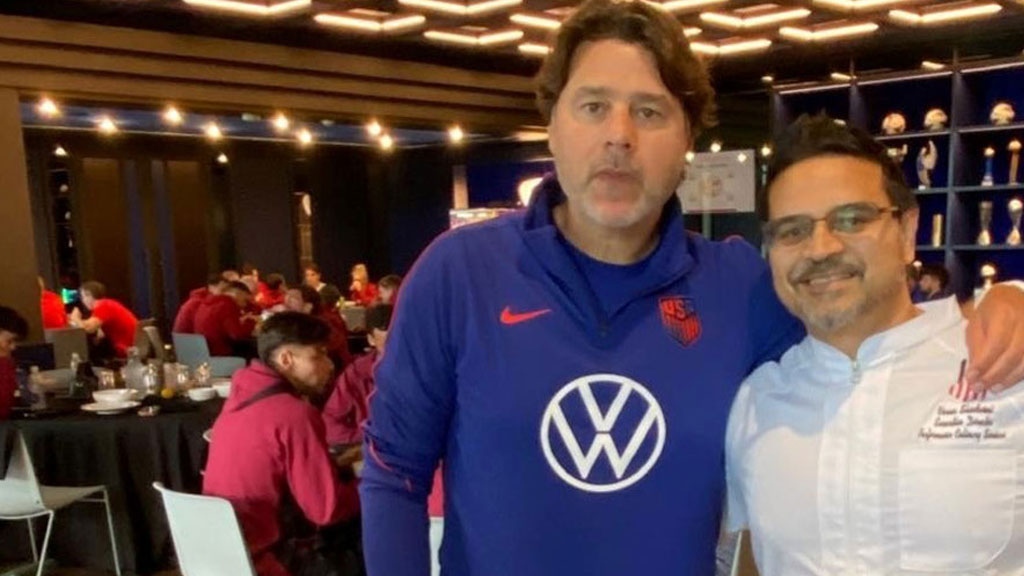 Varun Shivdasani and U.S. Men’s National Team’s Head Coach Mauricio Pochettino in the dining area with the team in the Arthur M. Blank U.S. Soccer National Training Center.