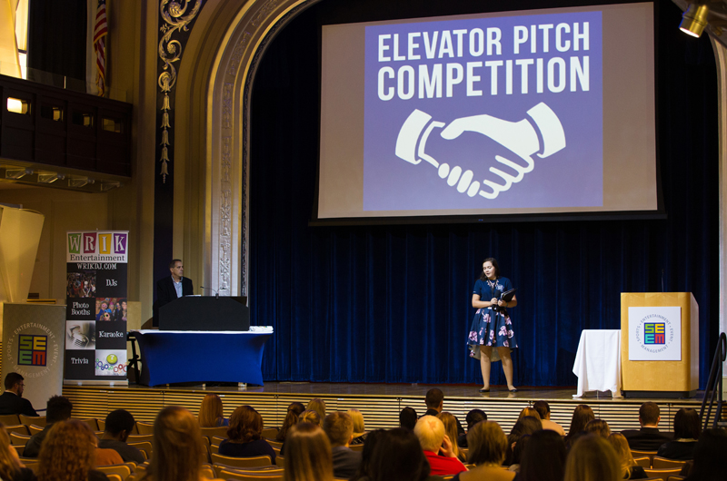 Student planner Paige Zuber '19 kicks off the elevator pitch competition.